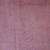 Detail van het donker roze Corduroy gordijn, JC2403 van okika. Toont de fijne ribbels in de luxe stof.
