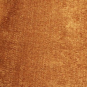 Goudgele Imperial-gordijnstof in close-up met zichtbare structuur en weving van de stof