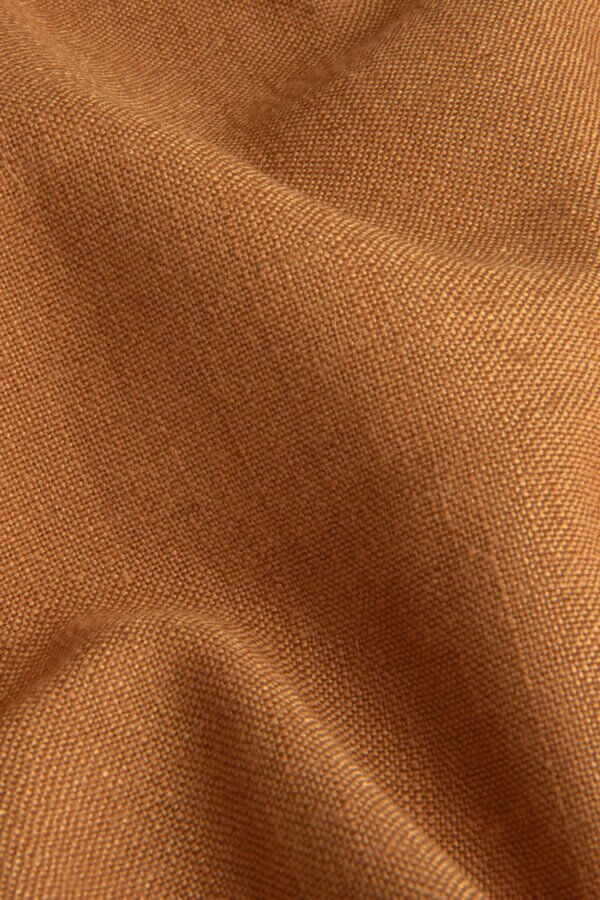 Elegance terrakleurige stof, vervaardigd uit polyester, viscose en linnen, met een warme, natuurlijke uitstraling.