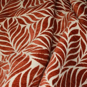 Van dichtbij zichtbare structuur van jacquard chenille gordijnen in terra met ingeweven bladmotief