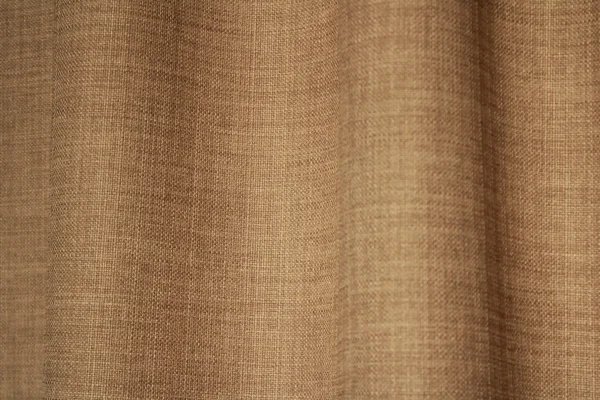 Detailfoto van de stof van lichtbruine gordijnen uit de Florain collectie (JC2515) van Okika, kleur vaste stof met subtiel gemeleerd effect