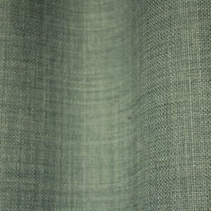 Close-up van het stofpatroon van turquoise gordijnen uit de Florain collectie (JC2526) van Okika, met een fijne weefstructuur die een speelse en heldere uitstraling geeft