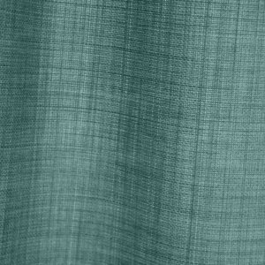 detailfoto van de stofstructuur van turquoise gordijnen uit de Florain collectie (JC2526) van Okika, met een subtiele weving die zorgt voor een frisse en levendige sfeer
