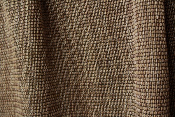 Bronzen inbetween gordijn uit de Linea collectie met luxe weefstructuur en subtiele glans in de stof.