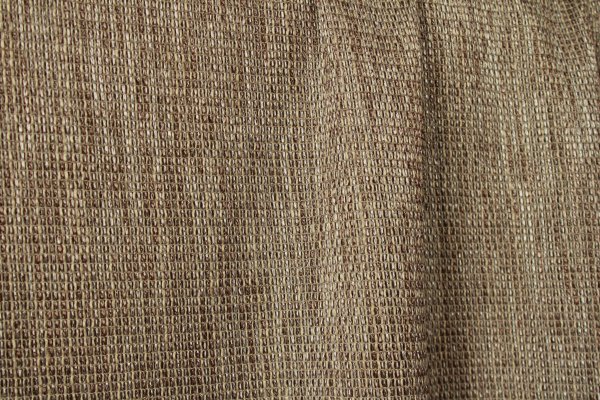 Taupekleurig inbetween gordijn Linea collectie met open weefstructuur en een warme tijdloze taupe tint