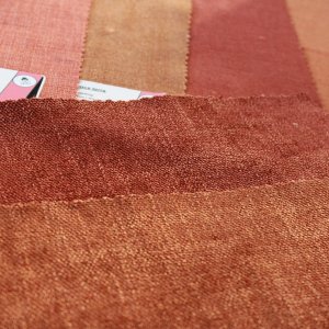 terracotta/oranje stalenpakket-gordijnen van Okika, warme en rustige kleuren