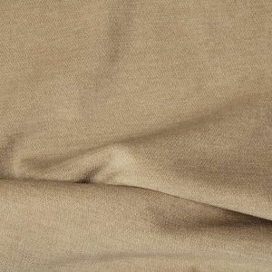 Stofstructuur van crèmekleurige chenille gordijnen van Okika, close up van de stof in elkaar gedraaid.