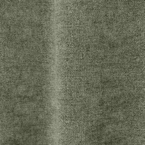 Stofdetails van groene chenille gordijnen van Okika, met zicht op de chenille structuur.