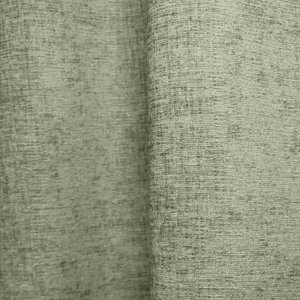 Sfeerfoto van mintgroene teddy chenille gordijnen van Okika, getoond in de plooi, met een frisse mintgroene kleur bij natuurlijk licht in het interieur.