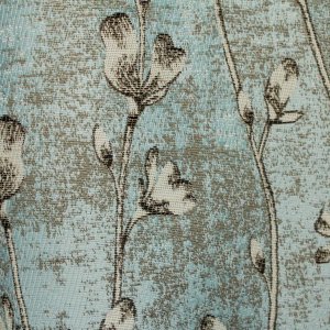 bloemen patroon zichtbaar in blauwe jacquard gordijnen stofdetails