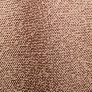 Stofdetails van licht roze bouclé gordijnen met zichtbare lusstructuur