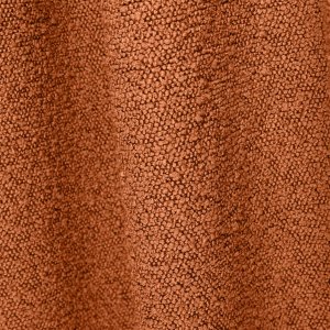 Detailbeeld van oranje bouclé gordijnen met grove stofstructuur
