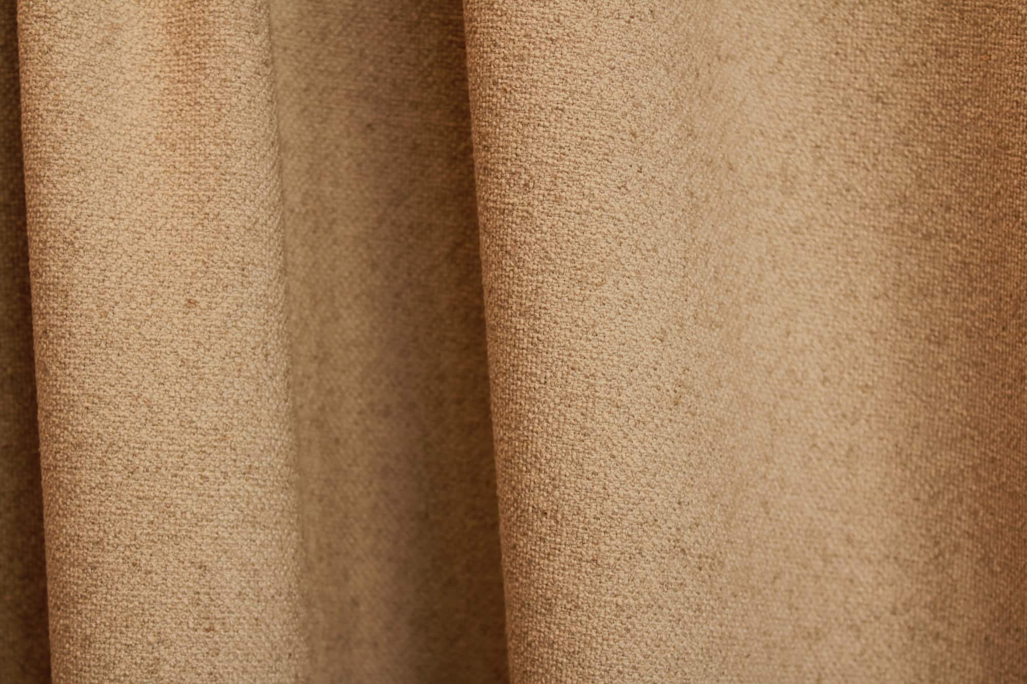 Beige Soft Bouclé gordijnen met een natuurlijke linnenuitstraling en subtiele boucle structuur.